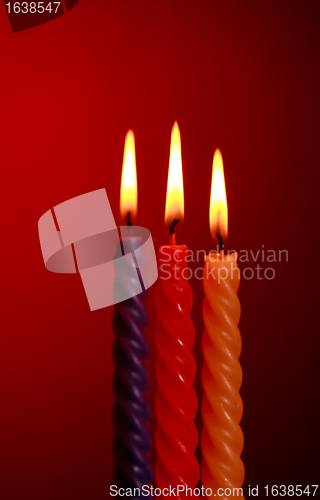 Image of Three Candles On Red