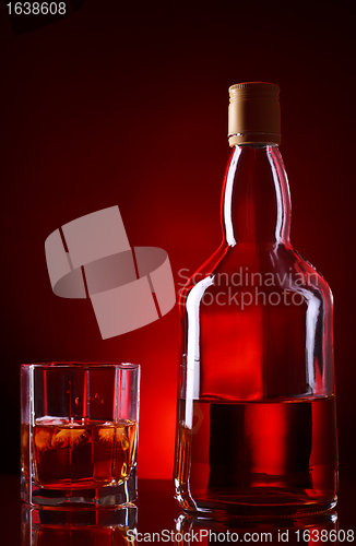 Image of Whiskey Bottle And Glass