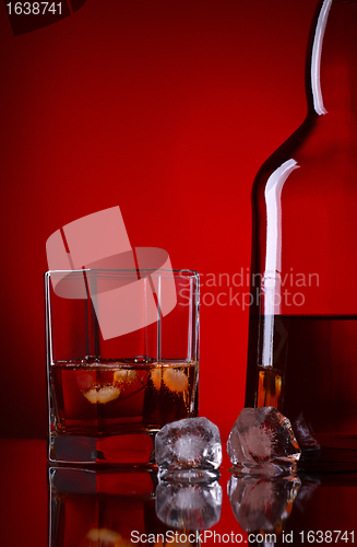 Image of Whiskey Bottle And Glass