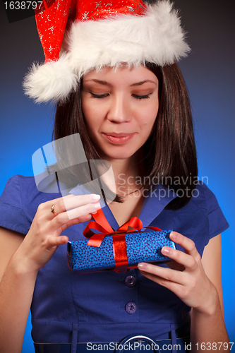 Image of christmas girl opening gift