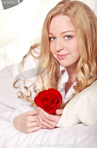 Image of Girl In Bed With Rose