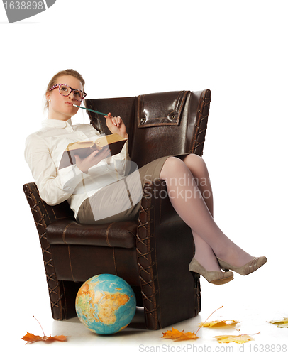 Image of female teacher sitting in armchair