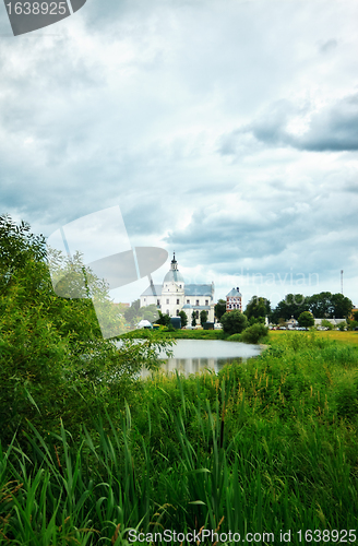 Image of monastery on lake at evening
