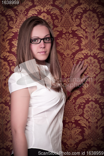 Image of girl standing next wall