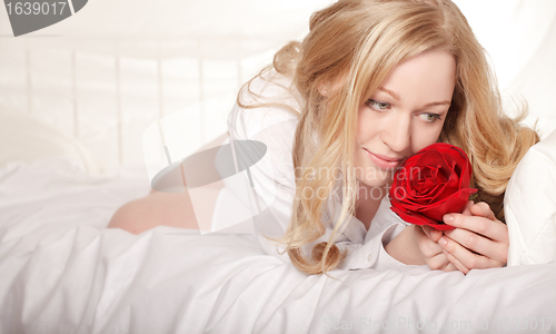 Image of Girl In Bed With Rose