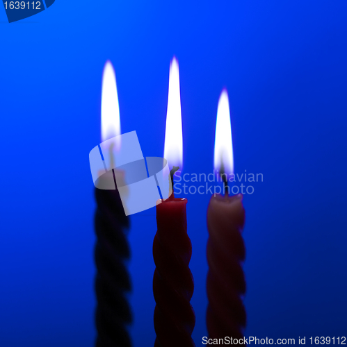 Image of Three Candles On Blue