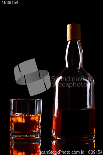 Image of Whiskey Bottle And Glass