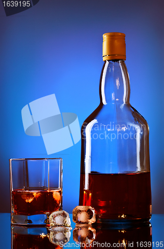 Image of Whiskey Bottle And Glass