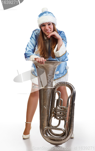 Image of funny santa girl with big trumpet