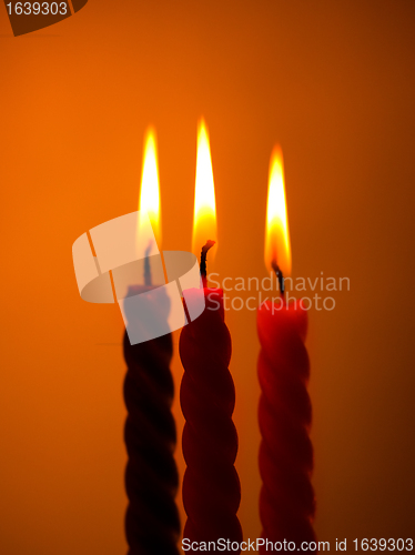 Image of Three Candles On Yellow