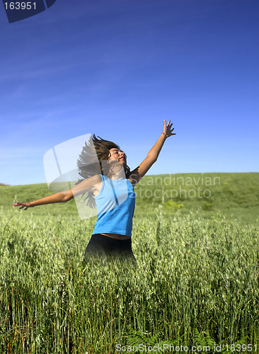 Image of Jumping on a green field