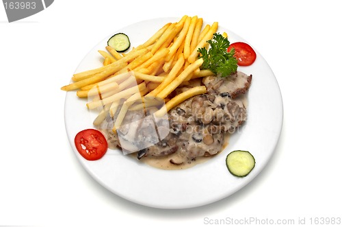 Image of veal medallion with mushroom white sauce and french fries