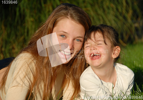 Image of two laughing sisters