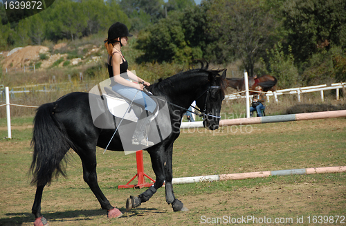 Image of riding young woman