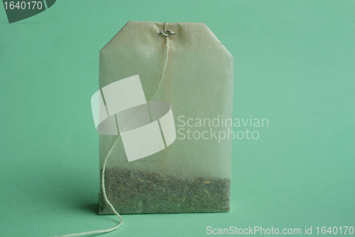 Image of Tea bag over green