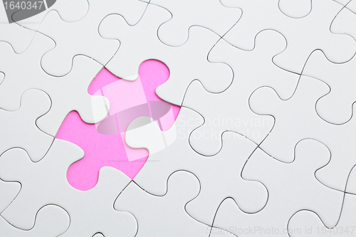 Image of puzzle with missing piece