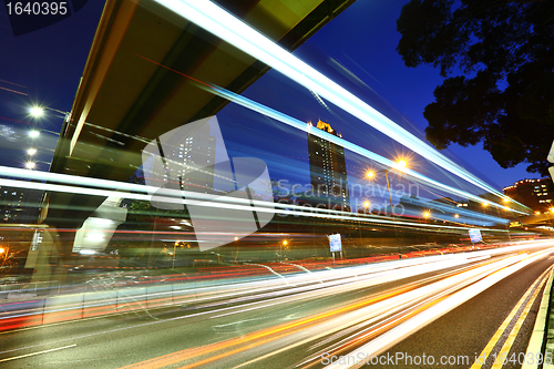 Image of city in night with busy traffic