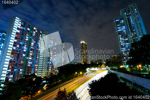 Image of night traffic light trail and city