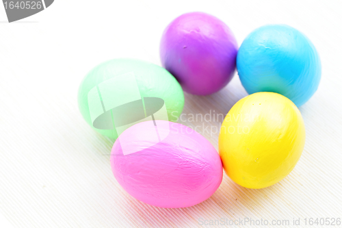 Image of children paint colorful easter eggs