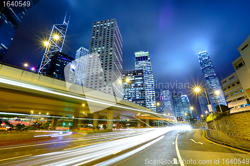 Image of night traffic light trail and city