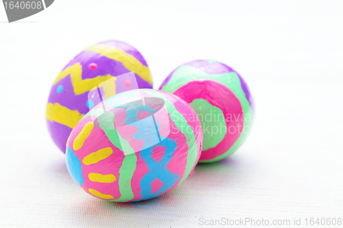 Image of children paint colorful easter eggs