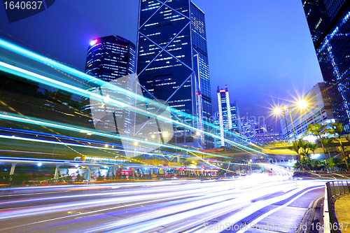 Image of city in night with busy traffic