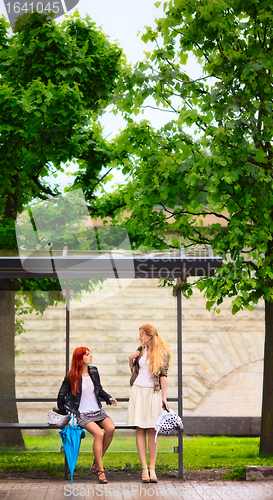 Image of Two Girls at Bus Stop