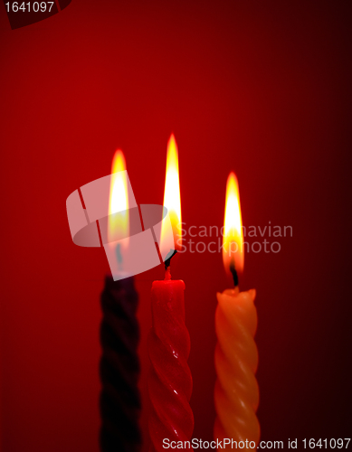 Image of Three Candles On Red