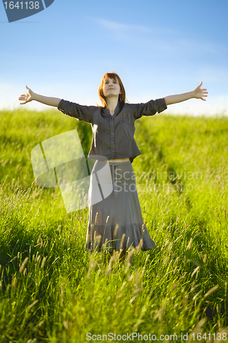 Image of happy woman in field