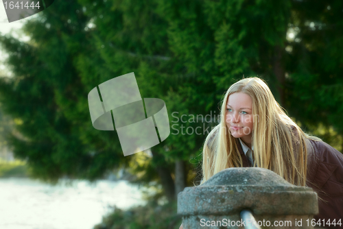 Image of Beautiful Woman Standing on River Bank