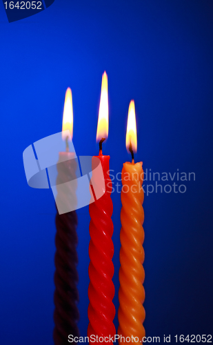 Image of Three Candles On Blue