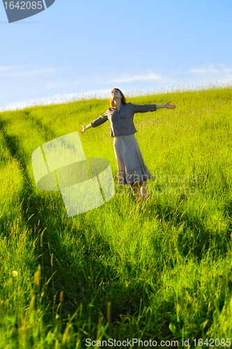 Image of happy woman in field