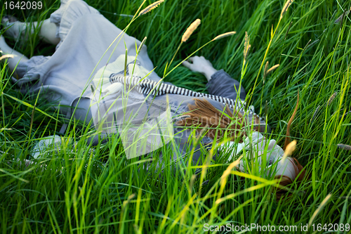 Image of Dead Woman Laying in Grass