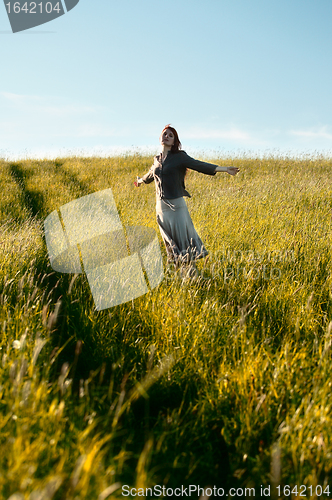 Image of happy woman in field