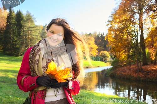 Image of Girl with Bunch of Leaves