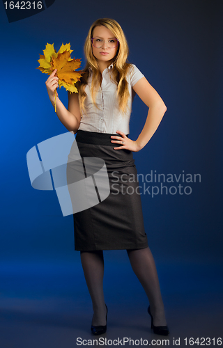 Image of pretty teacher with maple leaves