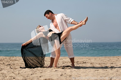 Image of Couple dancing on the beach