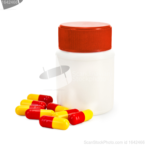 Image of Capsule red and yellow with a jar