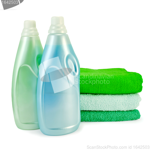 Image of Fabric softener in two bottles and towels