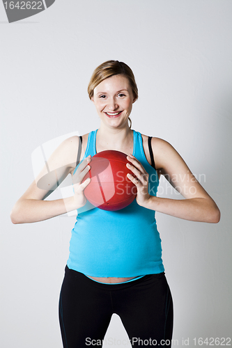 Image of Pregnant woman holding an exercise ball