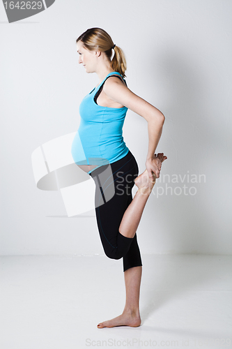 Image of Pregnant woman stretching