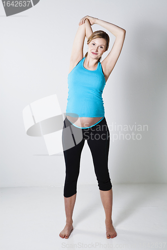 Image of Pregnant woman stretching