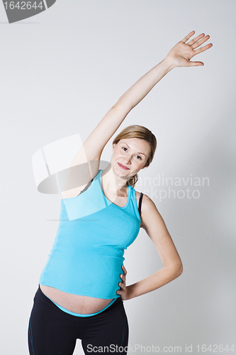 Image of Pregnant woman stretching