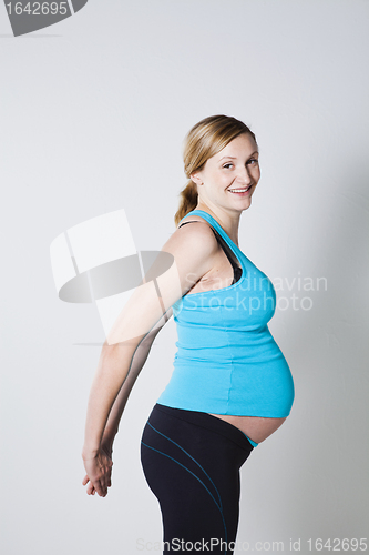 Image of Pregnant woman stretching