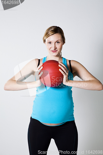 Image of Pregnant woman holding an exercise ball