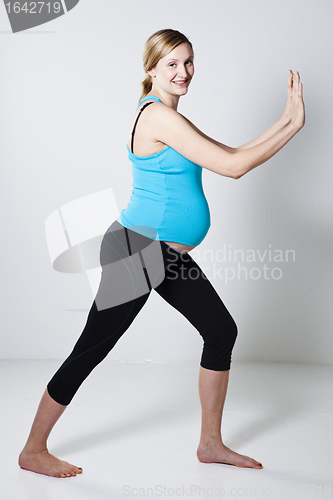 Image of Pregnant woman stretching