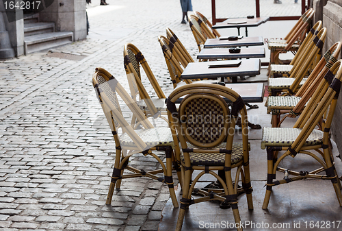 Image of Empty cafe tables in Brussels cobbled square