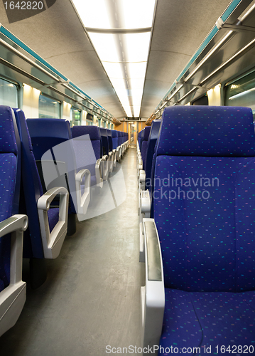 Image of Empty railway carriage with blue seats