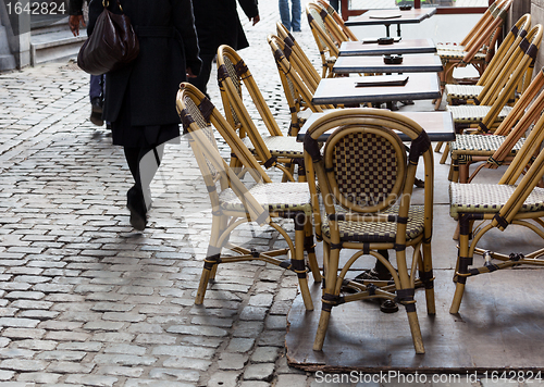 Image of Empty cafe tables in Brussels cobbled square