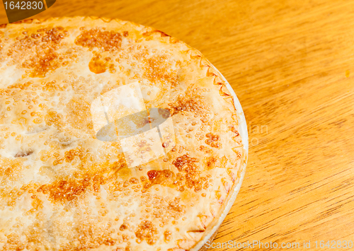 Image of Home made apple pie on wooden table